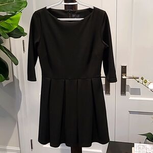 New Topshop black Ponte dress. Pleated skirt. Back hidden zipper. Size 8.